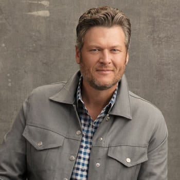 blake shelton smiling for the camera