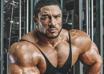 Roelly Winklaar wearing a black muscle top