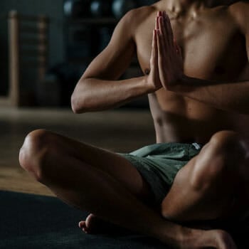close up image of a man's body during meditation