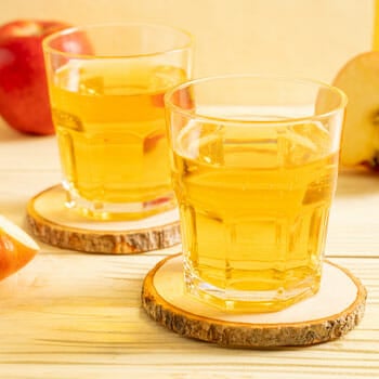 two shots filled with apple cider vinegar