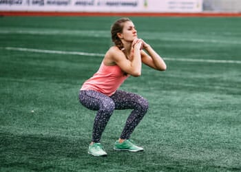 woman working out in a field