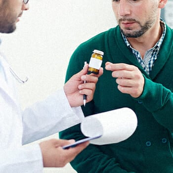 A doctor recommending a vitamin for the patient