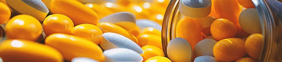 A close up shot of probiotics and vitamin supplements