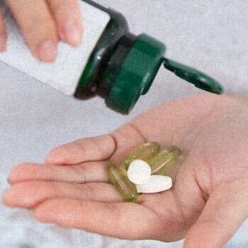 Pouring a multivitamin on hand