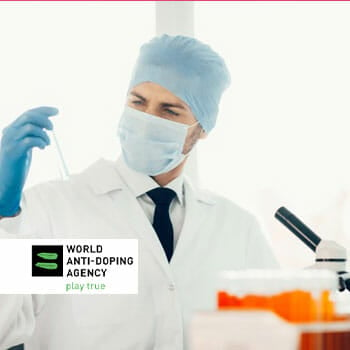 medical personnel testing out a sample with WADA Logo