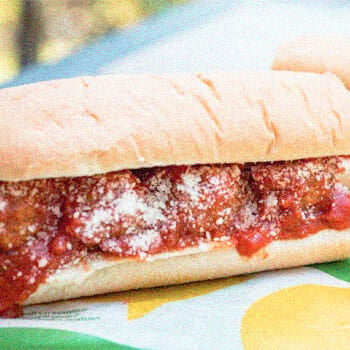 sandwich with meatballs and red sauce in it