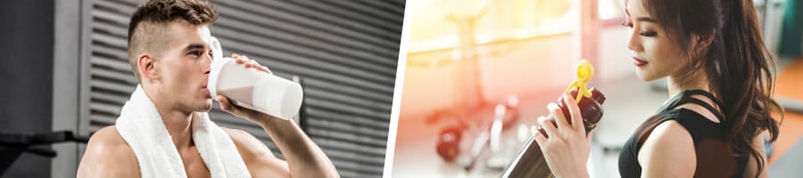 man and woman chugging a protein shake in a gym