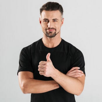 man in a black shirt with his hands in a thumbs up