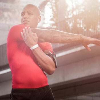 man doing stretches outdoors