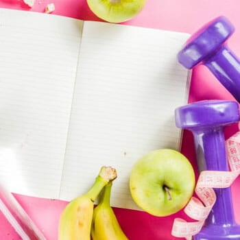 empty notebook with diet tools on the side