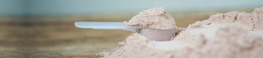 powder supplement in a scooper