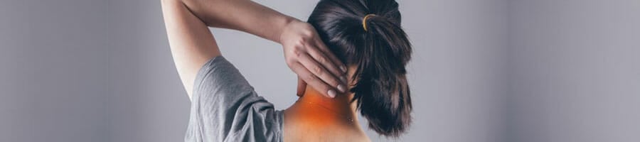 woman holding her nape in pain