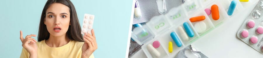 woman raising up a sachet of vitamins thinking, medicine kit