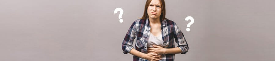 woman frustrated holding her stomach