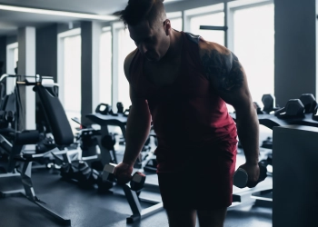 A man holding dumbbells for bicep workout