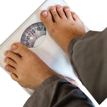 A person on a weighing scale