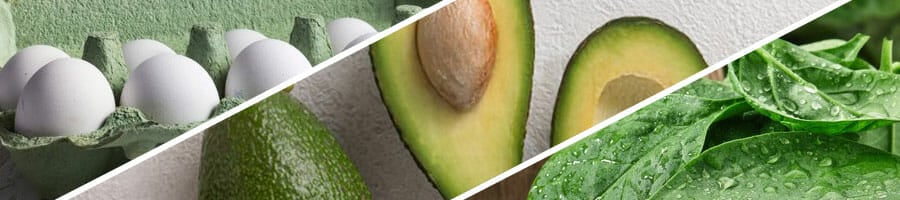 tray of eggs, sliced avocadoes and a bowl of green leaves