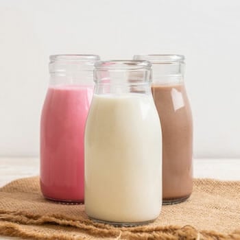 glass bottles of different flavored smoothies