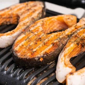 sliced salmons on a electric grill