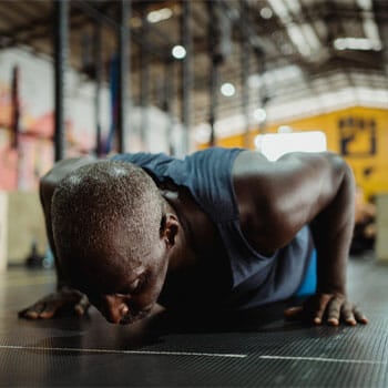 black man in a push up position