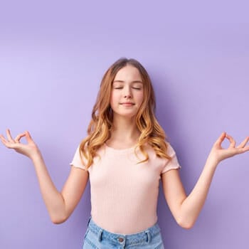 young female meditating in peace