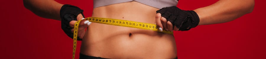 woman measuring her stomach