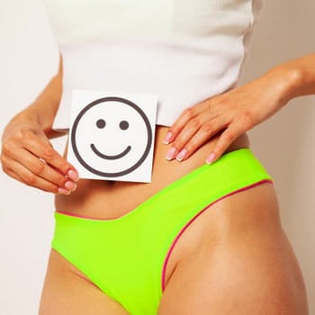 woman wearing undies showing her stomach and a smiley drawing