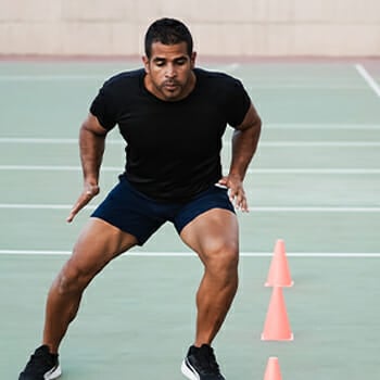 Man doing speed and agility cone