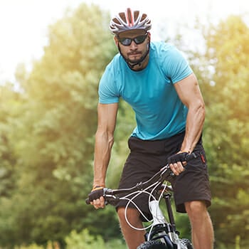 A man riding bicycle outdoors