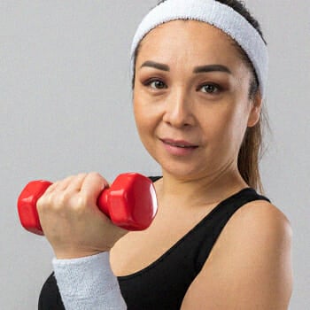 Woman holding a small dumb bell