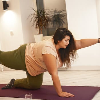 Woman stretching on a yoga mat