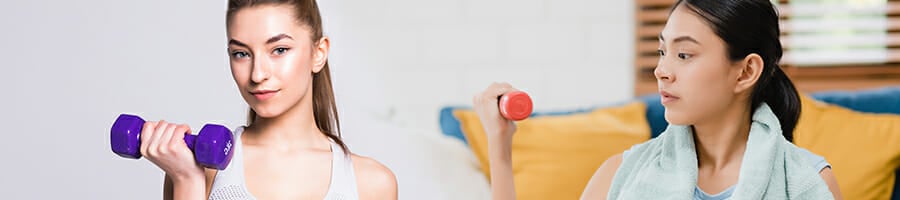 Two women holding a dumb bell for exercise