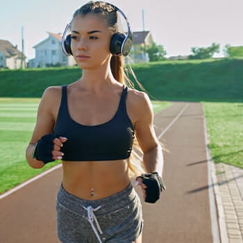 Woman walking while listening to music