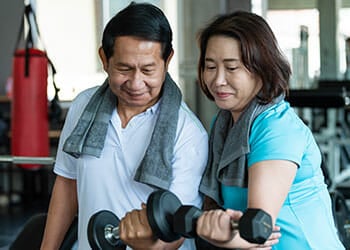 old couple working out in the gym