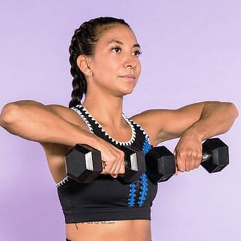 woman lifting dumbbells in both arms