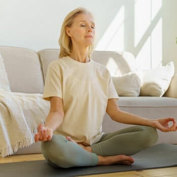 woman in a yoga pose at home