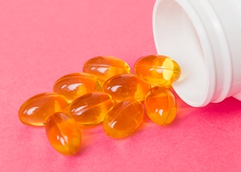 Supplements spilling out of a container