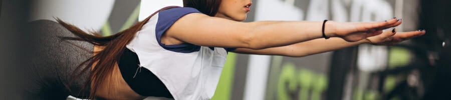 A woman in a hyperextension bench