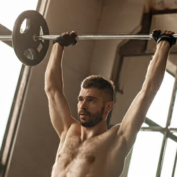 Bearded guy doing an overhead press