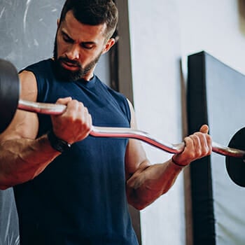 A man lifting an EZ bar