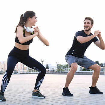 couple working out outdoors together