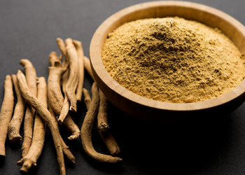 Ashwagandha extract in a bowl and roots