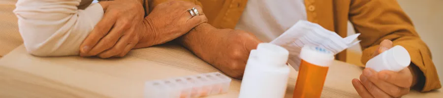 Two persons looking at a vitamin description