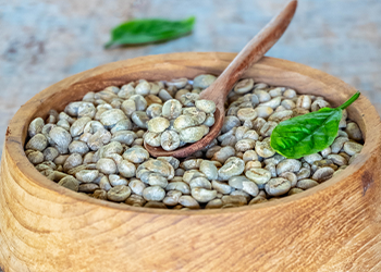 bowl filled with green coffee beans