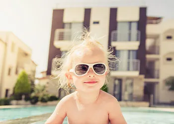 shirtless kid in the sun