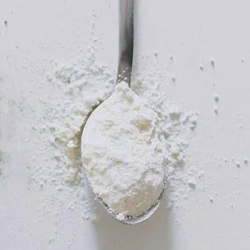 spoon filled with white powder