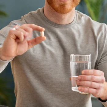 A man holding a Lmnitrix Spartn supplement