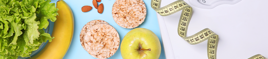 different vegetables and fruits with measuring tape and weighing scale