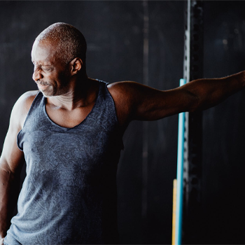 man stretching his arm