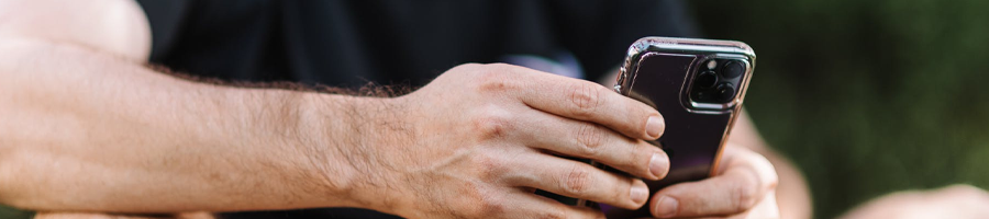 hand view of a man using his phone